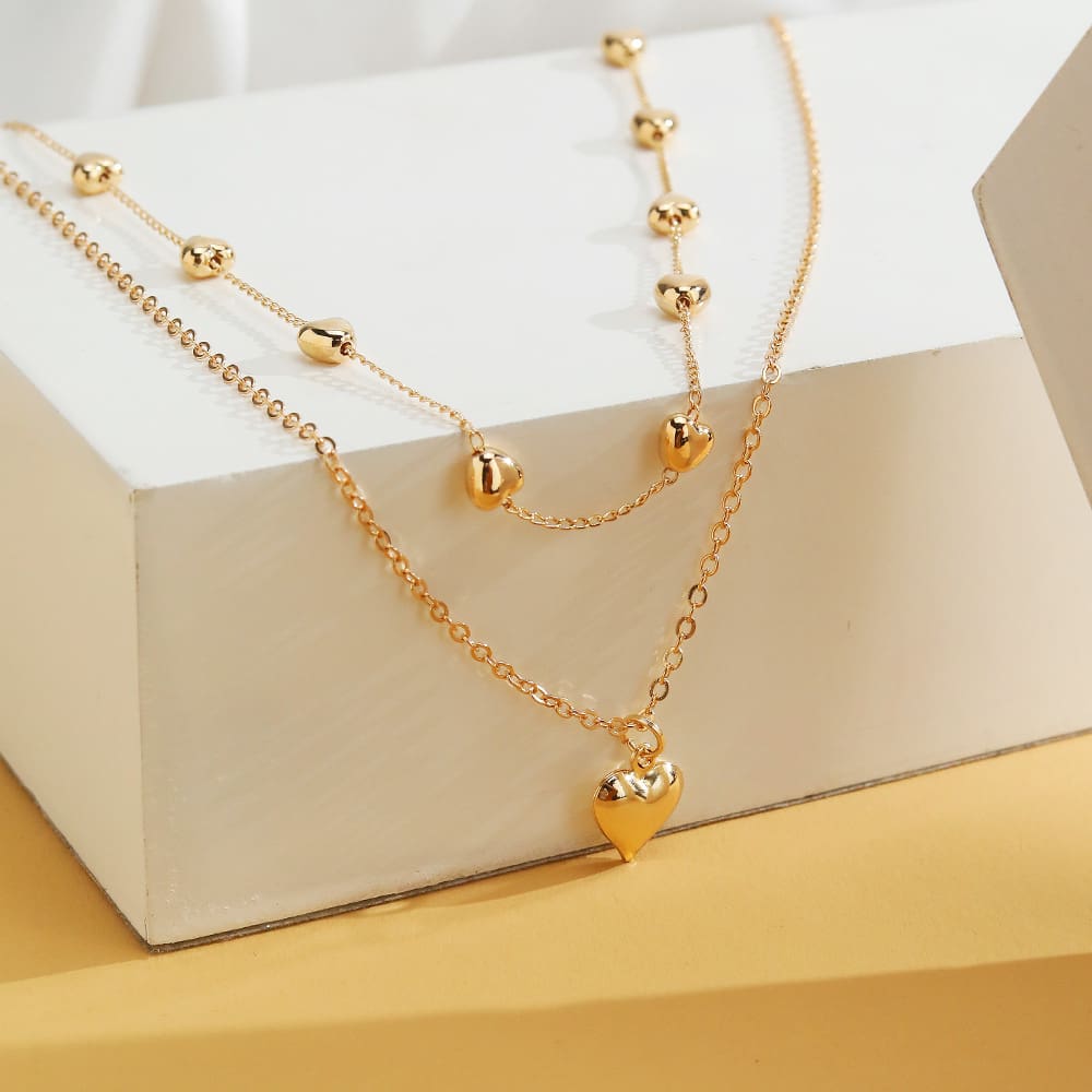 Collana a doppio strato con ciondolo a cuore e catena sottile per donna, collana multistrato in metallo color oro, gioielli alla moda, accessori. - immagine 6